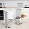 Two white, multi-tiered trash cans are shown in a kitchen setting. Produktbild-Vorschau