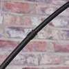 A close-up shot of a black metal pole with a joint, set against a brick wall background. Produktbild-Vorschau