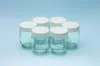 Six empty glass jars with white lids arranged in a circular pattern. Produktbild-Vorschau