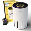 A Klyqa air purifier and its packaging are displayed on a white background, along with a smartphone showing the device's app interface. Produktbild-Vorschau