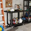 A workshop or garage setting with tools and storage. Podgląd zdjęcia produktu