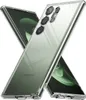 Two clear phone cases are shown diagonally crossed over each other, with a green background visible through them. Náhľad obrázku produktu