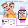 Two children wearing sunglasses are posing for a photo with a smartwatch on one of their wrists. The smartwatch screen shows a photo of the two children. Below them is a collection of cartoon icons and text. Náhled obrázku produktu