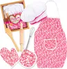 A collection of children's cooking accessories laid out on a white background. Produktbild-Vorschau