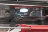 Close-up view of the interior of a dishwasher with the light on. Produktbild-Vorschau