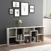 A modern gray bookshelf filled with books and decorative items, against a gray wall with framed art. Náhľad obrázku produktu