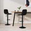 Two black bar stools are placed around a wooden table in a dining area. Náhľad obrázku produktu