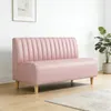 A pink sofa in a room with a plant and a picture on the wall. Anteprima dell’immagine prodotto