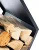 A close-up view of a black metal firewood rack filled with logs. Podgląd zdjęcia produktu