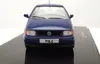 A blue Volkswagen Polo model car is displayed on a black base. Produktbild-Vorschau