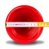 A red plunger is shown from a top-down perspective, with a measuring tape across its opening. Produktbild-Vorschau