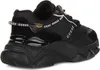 A black Guess sneaker for women is shown from the side and back. Produktbild-Vorschau