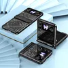 Three black flip phone cases are displayed on a light blue and white tiered surface, with a decorative blue background. Produktbild-Vorschau