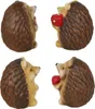 Four ceramic hedgehog figurines, each holding a red object (one a mushroom with white spots, the others a red apple). Náhľad obrázku produktu