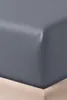 A close-up view of a gray fitted sheet on a bed. Produktbild-Vorschau
