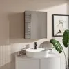A modern bathroom vanity with a sink, faucet, and a mirror cabinet. Náhled obrázku produktu