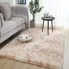 A living room scene with a sofa, rug, and a small table. Náhled obrázku produktu