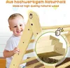 A smiling child is holding onto a wooden climbing structure, with a close-up inset showing the wood grain and construction. Produktbild-Vorschau