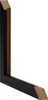 A corner piece of a black picture frame with a visible wood grain interior. Produktbild-Vorschau