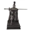 A bronze-colored figurine of a Roman centurion kneeling with a sword. Produktbild-Vorschau