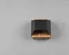 A modern wall lamp with a black hexagonal shade and a wooden base, mounted on a gray wall. Podgląd zdjęcia produktu