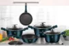 A set of teal cookware is displayed on a stovetop against a white tiled backsplash. Anteprima dell’immagine prodotto