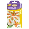 A package of chocolate carrot decorations for baking, shown with some of the decorations scattered on a cake and a cupcake. Náhľad obrázku produktu