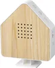 A product shot of a house-shaped sound machine with a wood-grain front panel and white casing, resting on a white stand. Produktbild-Vorschau
