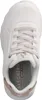 A top-down view of a white sneaker with pink laces and gold accents. Voir les images du produit