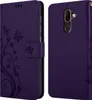 A purple flip phone case with a floral design is shown from two angles. Náhled obrázku produktu