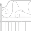 A close-up of a white metal headboard with decorative scrollwork. Produktbild-Vorschau