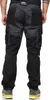 A person wearing black and gray cargo pants. Produktbild-Vorschau