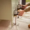 Two Stanley Fatmax clamps are being used to support a light green cabinet. Náhľad obrázku produktu
