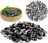 A collage of shungite stones in different forms and quantities, including a wooden bowl, a pile of small crystals, and a larger pile of processed stones. Anteprima dell’immagine prodotto