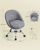 A diagram showing the dimensions of a gray office chair with a person sitting in it. Náhled obrázku produktu