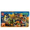 The image shows the packaging of a LEGO City Stuntshow-Truck set, featuring various stunt vehicles and minifigures in action. Produktbild-Vorschau