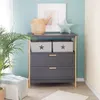 A nursery or child's room setting with a changing table, plant, and decorative items. Produktbild-Vorschau