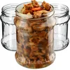 Three glass jars, one filled with preserved mushrooms and the other two empty, are arranged on a white background. Anteprima dell’immagine prodotto