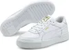 A pair of white Puma sneakers with gold accents, shown from a slightly elevated side view with the sole of one shoe visible. Produktbild-Vorschau