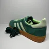 A studio shot of a single Adidas Handball Spezial sneaker. Produktbild-Vorschau