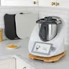 A kitchen counter with a food processor and accessories. Produktbild-Vorschau