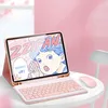 A pink tablet case with a keyboard and mouse, featuring a cartoon illustration on the tablet screen. Náhľad obrázku produktu