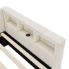 A close-up view of the headboard of a bed, showing built-in storage compartments and a USB charging port. Podgląd zdjęcia produktu