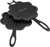 A black cast iron waffle maker shaped like a flower or heart, with the top half open, revealing the waffle grid pattern. Produktbild-Vorschau
