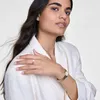A woman wearing jewelry and a watch. Produktbild-Vorschau