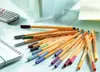 A collection of STABILO point 88 fineliner pens scattered on a desk next to a notebook and a calculator. Produktbild-Vorschau