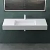 A modern white wall-mounted sink with a minimalist faucet and a large illuminated mirror above it, set against a dark teal wall and gray tiled floor. Produktbild-Vorschau