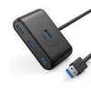 A black USB hub with multiple ports and a connected USB cable is shown on a white background. Náhľad obrázku produktu