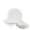 A white porcelain dinnerware set with gold trim, including plates, bowls, and salt and pepper shakers. Produktbild-Vorschau