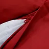 Close-up view of a red outdoor beanbag with a partially unzipped white inner lining. Produktbild-Vorschau